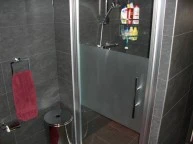 Tegelzetten badkamer vloer wand